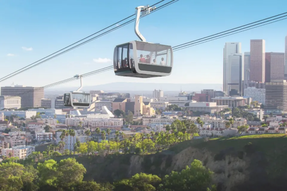 Rendering of aerial gondola passing over Dodger Stadium with L.A. skyline in background
